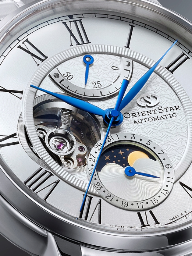 A silver watch with a blue face